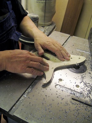 Routing pickguard edge flush with the template.