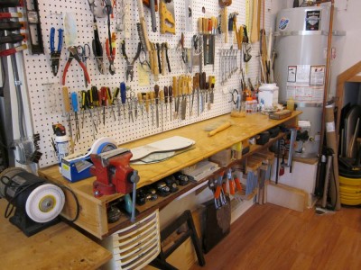 And last down that row is a high bench with a peg-board above it. This is a great place to do neck work.