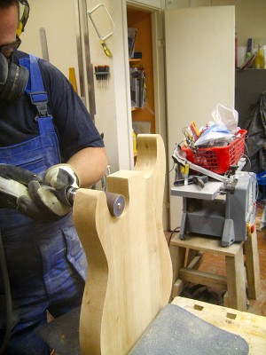 The cutaways are easiest sanded with a drum attached to a power drill with an extension chuck.