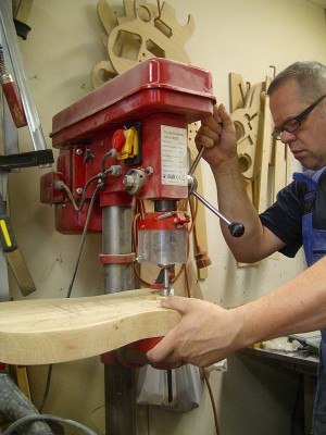 After finishing the neck I continued with the body, drilling away excess wood from the neck pocket with a forstner bit before routing it.