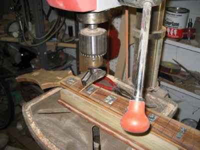 Using the drill press to install frets - I unplug the drill press to overcome the urge to turn the thing on while pressing frets.