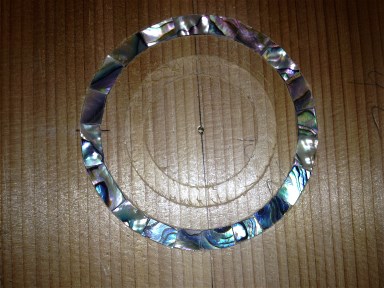 Abalone rosette inlaid in test rosette channel.