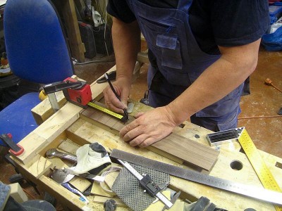 Measuring fret distances from the nut, with a digital measuring tape and a steel ruler. I use a pdf-based freeware program called fretcalc to determine the distances. Fretcalc can be used both with inches and millimetres.