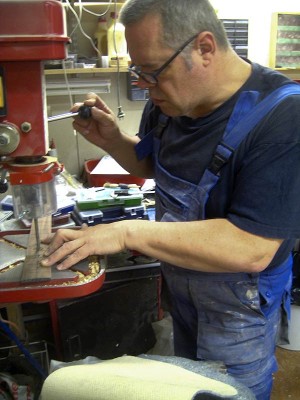 Drilling cavities for position markers. The markers are 6 mm diameter dots of real mother of pearl. I've purchased them from http://orders.mopsupplies.com/ where they cost 10 cents apiece and were swiftly delivered to Finland for an 8 € cargo. A guitar parts store in Helsinki charges 1.50€ for one dot. I'm not paying that.