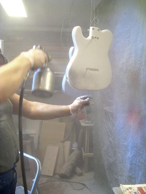 After spraying the second coat of primer and sanding the surface smooth I sprayed the body with silver paint until it was nice and even.