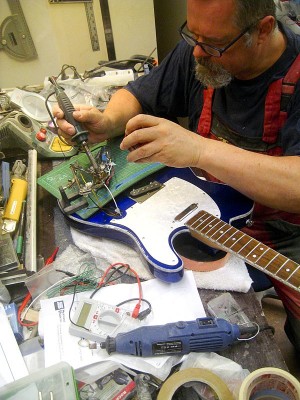 Soldering the pickups to the electronics.