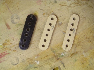 I used standard 50 mm and 52 mm spaced humbucker bobbins for models when I made plywood jigs for flatwork.