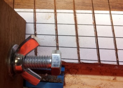 Note that the saw kerfs are parallel to the marker lines.  This is not a problem; it is a result of the difference in thickness of the straightedge and sawblade.  It is a problem if the offset is inconsistent -- this reveals inconsistent alignment of the straightedge relative to the marker line, or overworking of the saw.  A sharp blade and light stroke are what's needed -- not brute force.  I would dedicate one blade to this purpose.